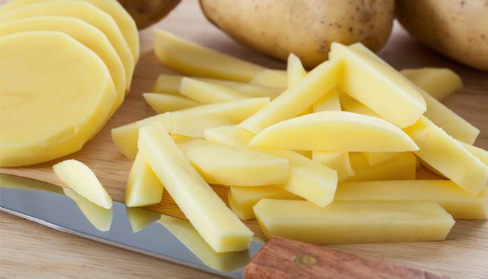 cut potatoes to make home made chips in air fryer