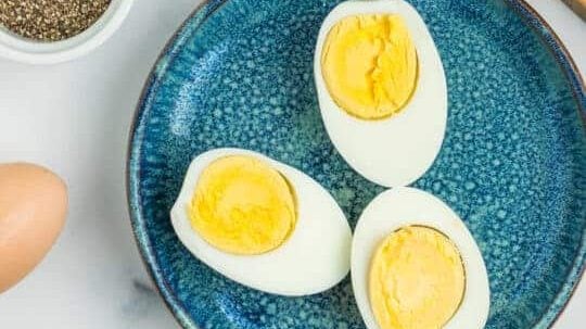 Halves of boiled egg on a plate.