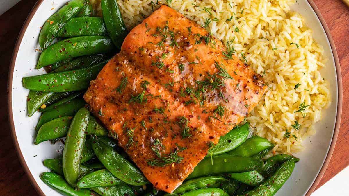 Miso honey mustard salmon served with green beans and rice.