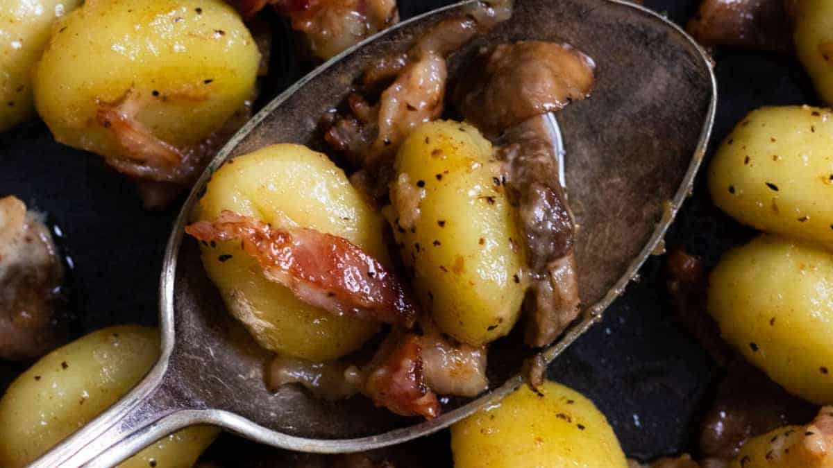 A spoonful of bacon mushroom gnocchi.