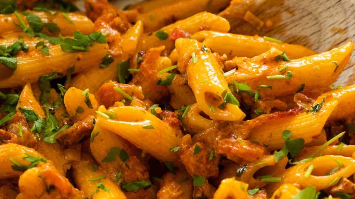 Pink pasta with bacon.